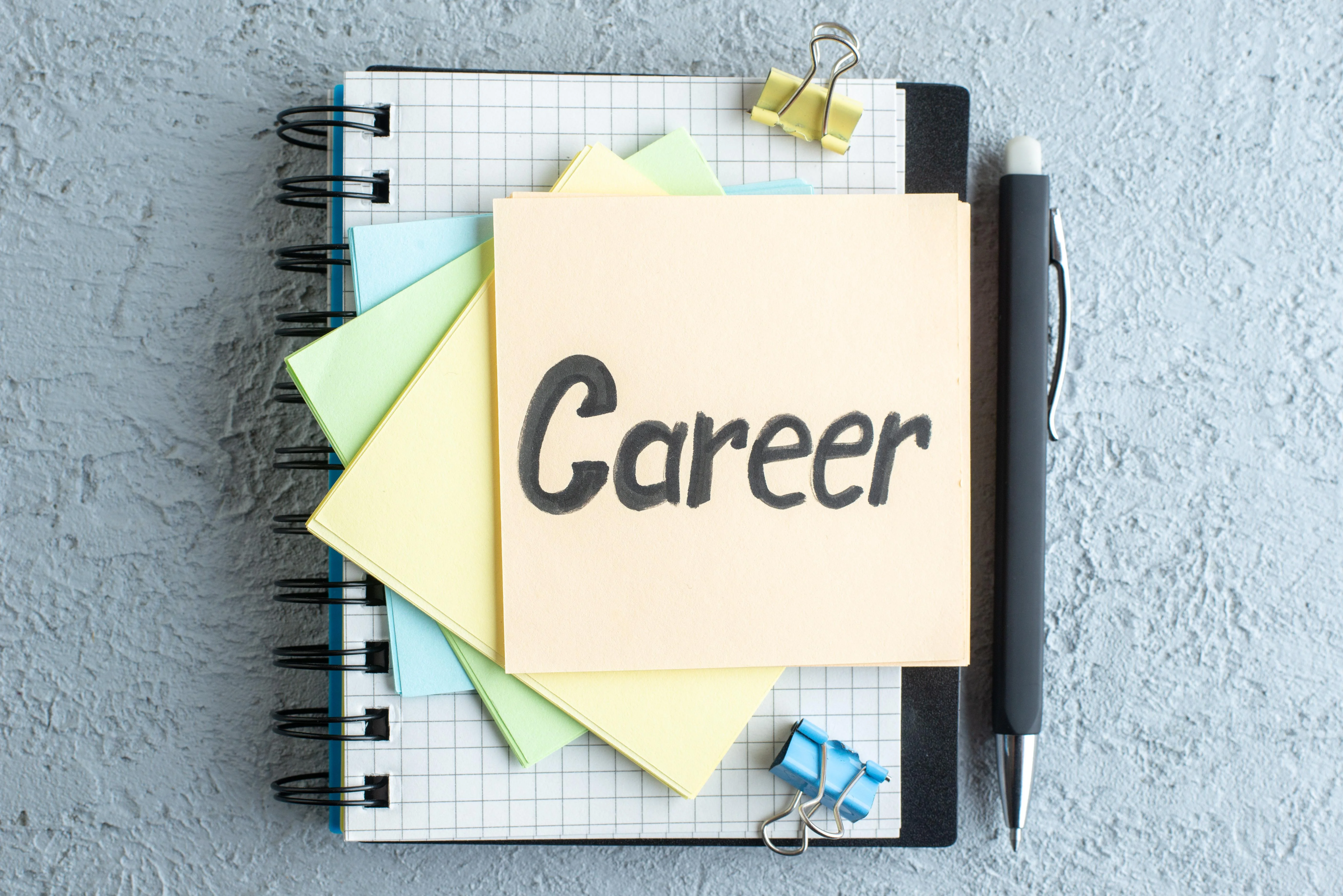top view career written note with stickers notepad white surface job office school copybook salary college business color.jpg